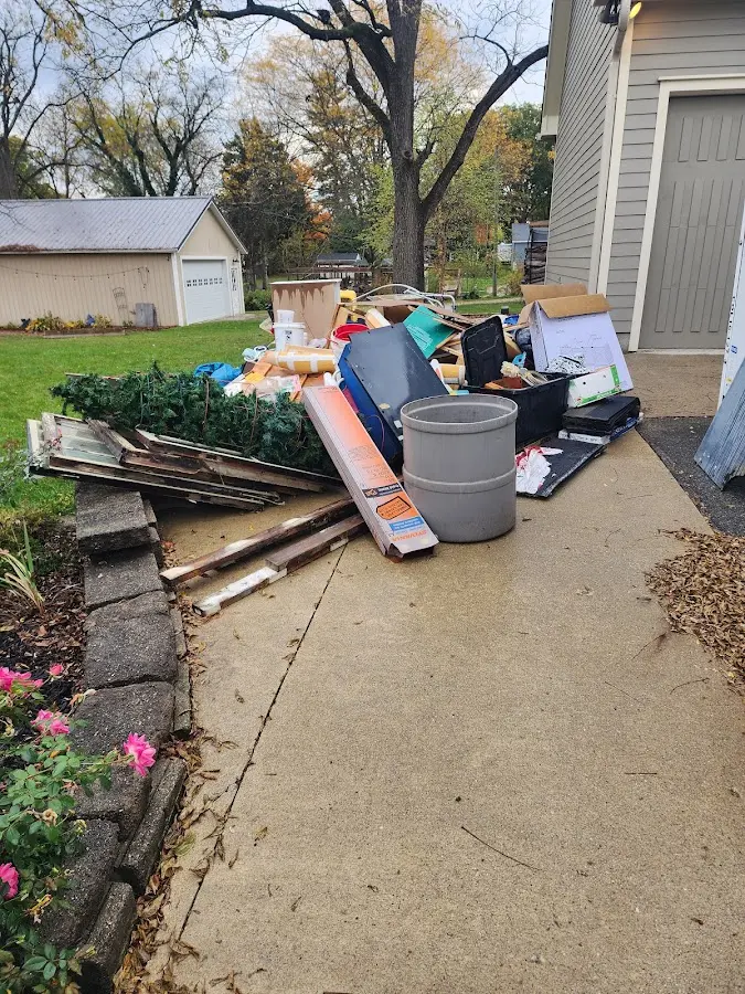 Dumpster being loaded with debris for Roofing Dumpster Rental in Bermuda Run